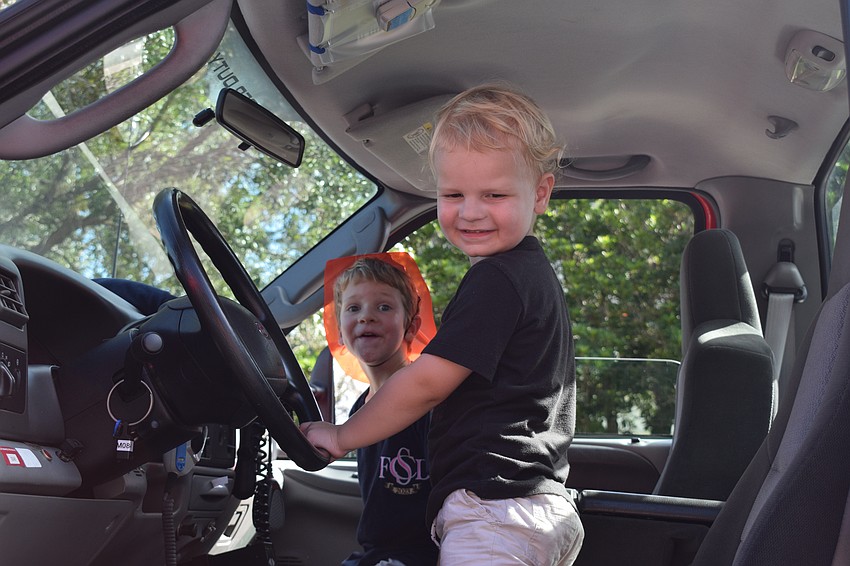 Lakewood Ranch 4-year-old Dunham Brishke and 3-year-old Foster Brishke check out various first responder vehicles. 