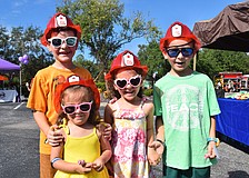 Although Lakewood Ranch 8-year-old Kenny Van Slyck, 3-year-old Carmela Van Slyck, 5-year-old Angelina Van Slyck and 6-year-old Vincent Van Slyck love seeing the first responder vehicles, they also love the free snacks.