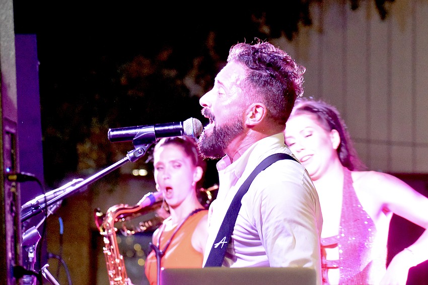 Brett Foreman of The Brett Foreman Band leads the performance.