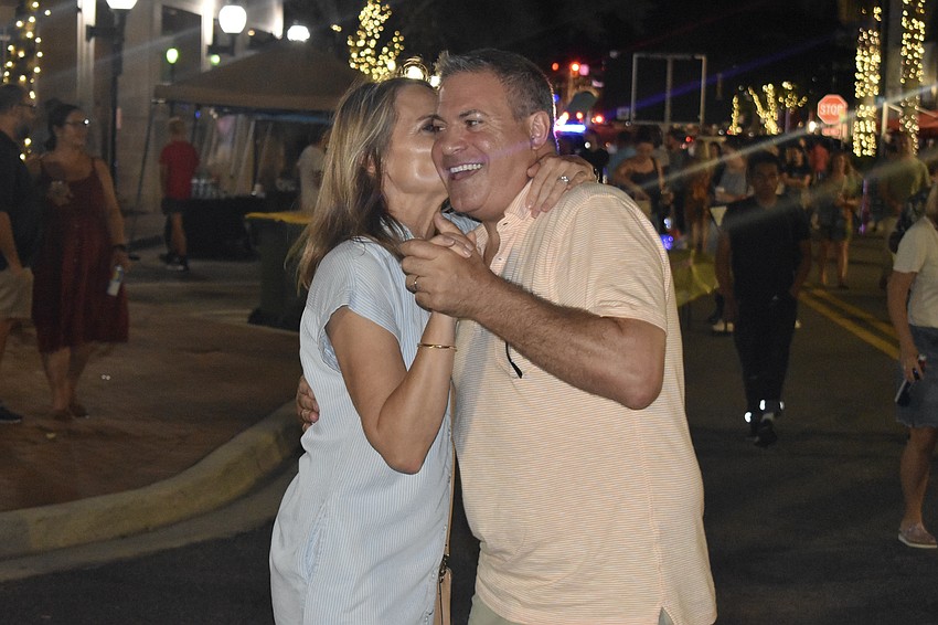 Kim and Corey Scandin dance to the music.