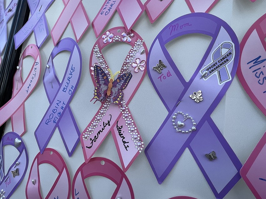 Ribbons are decorated in honor of those impacted by cancer.