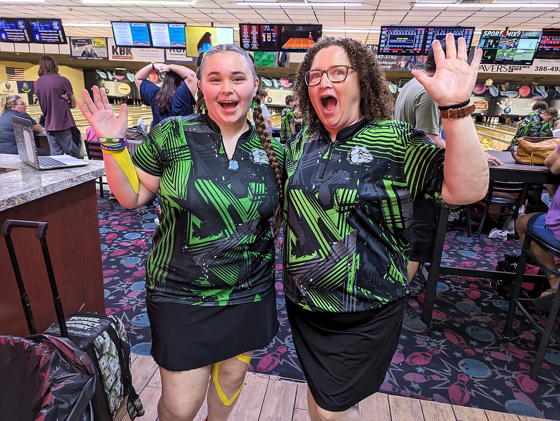 Emma Pezzullo and Flagler Palm Coast girls bowling coach Laura Oliva are excited after Pezzullo bowled her first 300 game on Oct. 4 in a match against Spruce Creek. Photo by Brent Woronoff