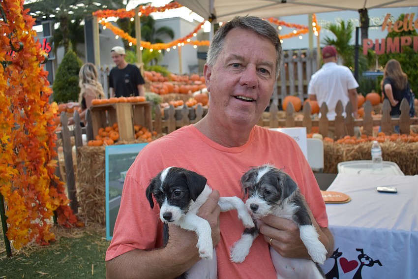 Nate's Honor Animal Rescue's Rob Oglesby shows off a couple of the rescue's current tenants, Jackie and Victoria, who are terrier-mix sisters.
