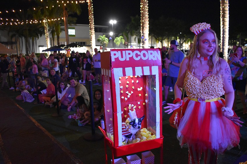 Tampa's Madi Sparks won the Most Creative division of the costume contest at Barks and Boos with 13-year-old Daisy, who seemed to enjoy her perch in a popcorn machine.