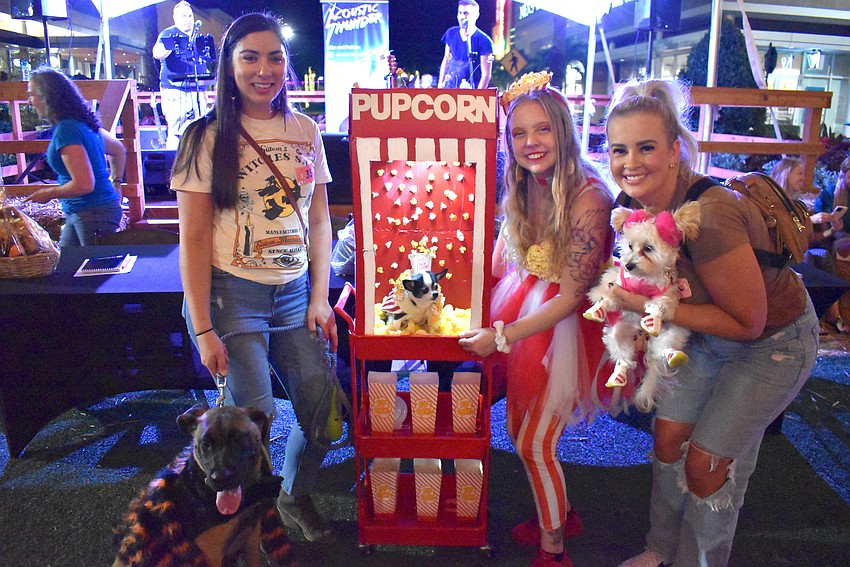 The Barks and Boos costume contest winners are Myakka's Alexis Urban with Zanie as a spider (Scariest); Tampa's Madi Sparks with Daisy in Pupcorn (Most Creative); and Sarasota's Olivia Gibson with Pixie as a cheerleader (Cutest).