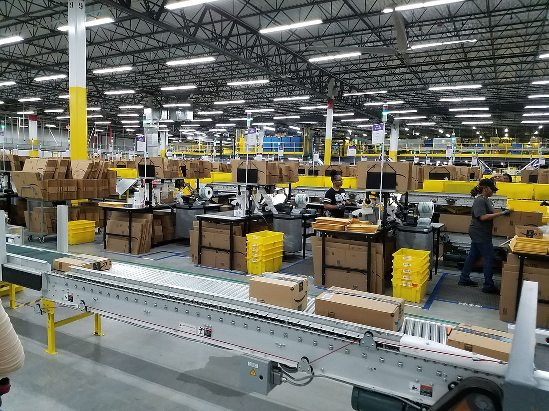 Workers inside the city’s first Amazon fulfillment center near Jacksonville International Airport. The internet retailer now has 16,000 workers in the city, according to JAX Chamber.