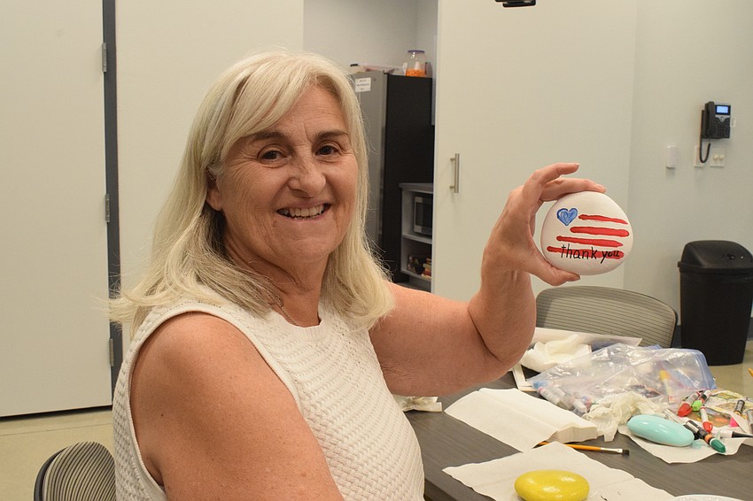 East County's Nell Johnston takes pride in her memorial rock in honor of veterans.