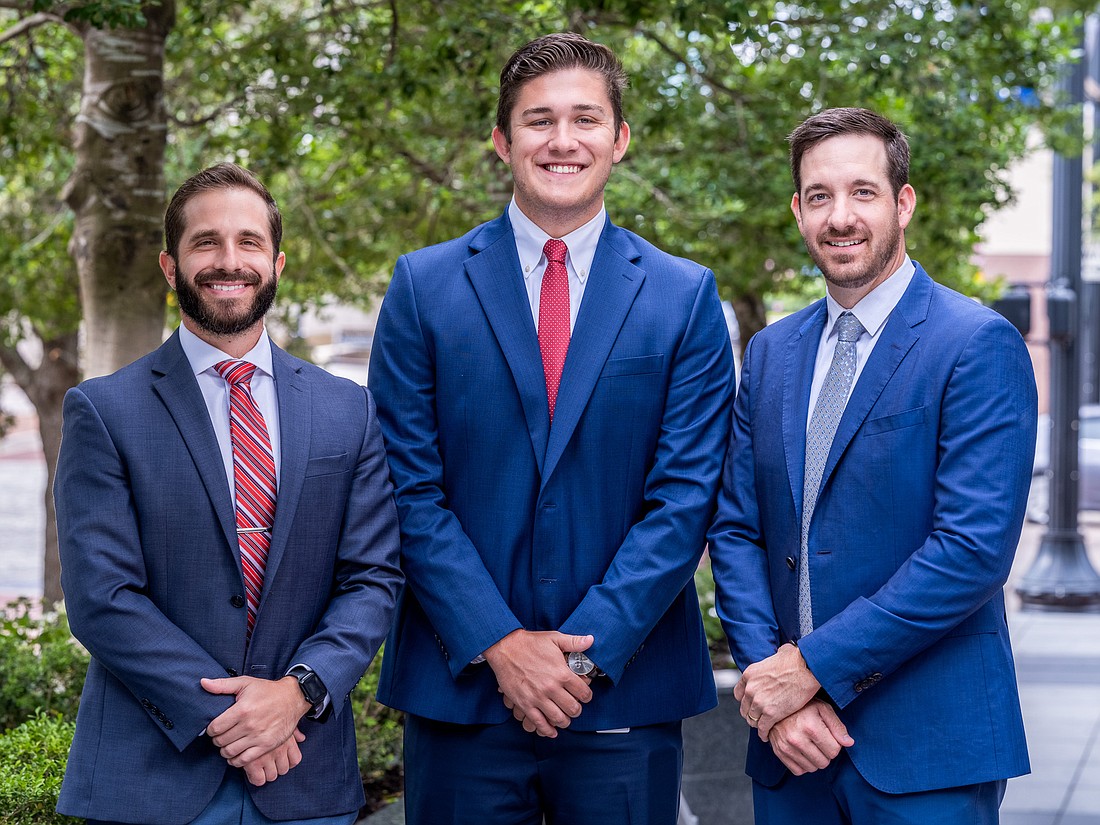 From left, Matthews Real Estate Investment Services associates William (Will) Bruce and Jacob (JT) Larson and First Vice President Cameron Hooper.