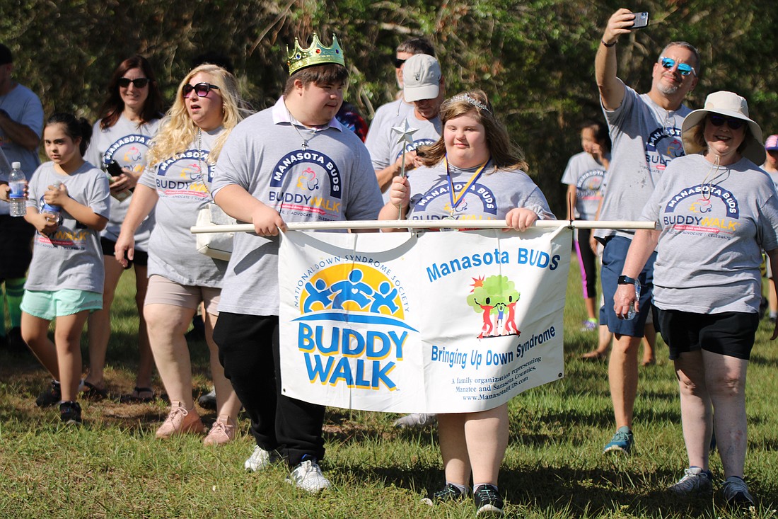Crowned king and queen, Mason Kramer and Emily D'Agostino lead the 2022 Buddy Walk.