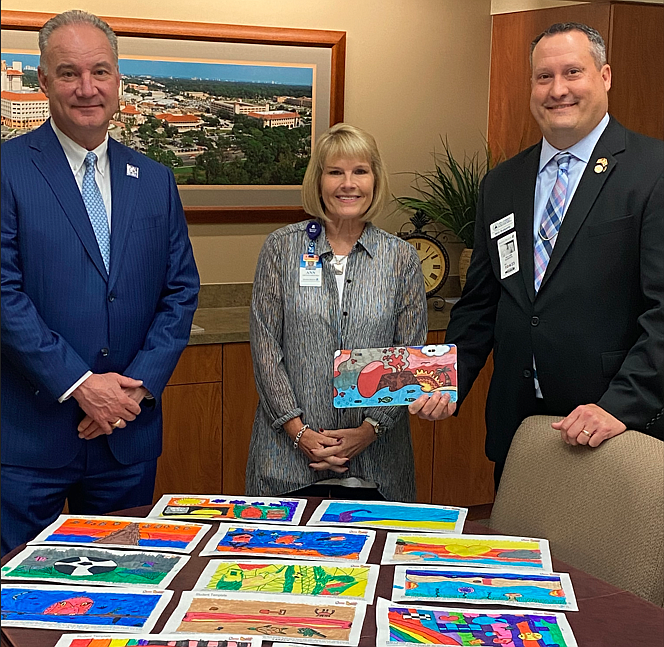 Jeff Feasel, president and CEO of Halifax Health; Ann Martorano, chief communications officer for Halifax Health; and Will Robert, tax collector of Volusia County. Courtesy photo