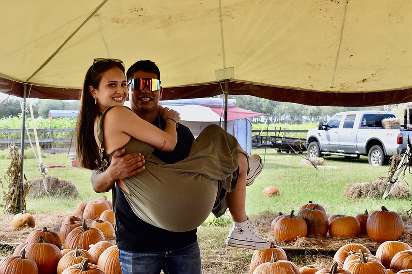 Sarasota residents Isabella and Martin Martinez have been attending the Pumpkin Festival since they were kids. They're taking one more photo to add to their collection.