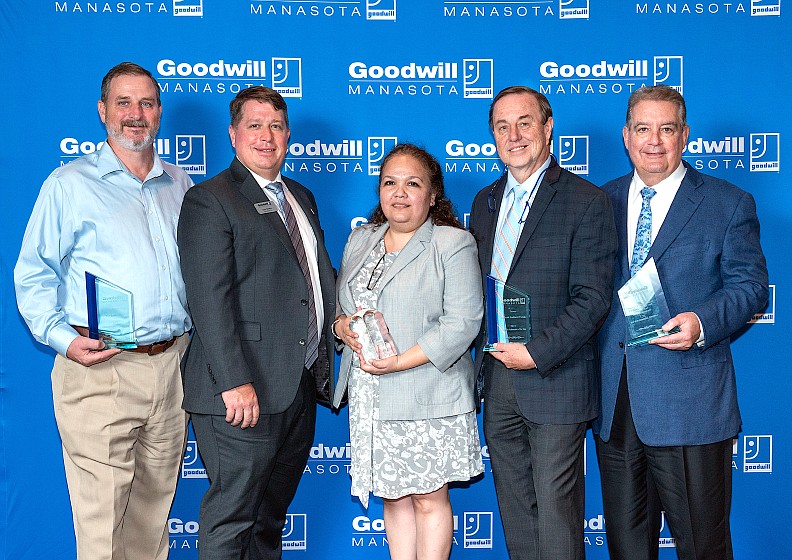 Goodwill Manasota President and CEO Donn Githens (second from left) with the Community Ambassador Awards Luncheon honorees (from left) Rob Kehs, Dora Talamantes, Tom Waters and Bill Isaac.