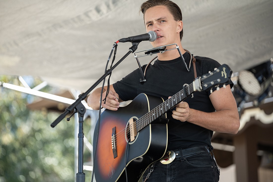 Singer-songwriter Dean Batten performs at the Ormond Beach Live Original Music and Art Festival on the Rockefeller Gardens main stage. Photo by Michele Meyers