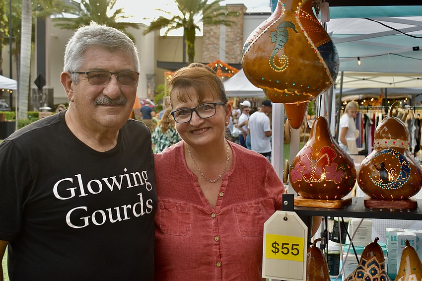 Husband and wife Serap and Tufan Ozgen sell their Glowing Gourds at the UTC night market.