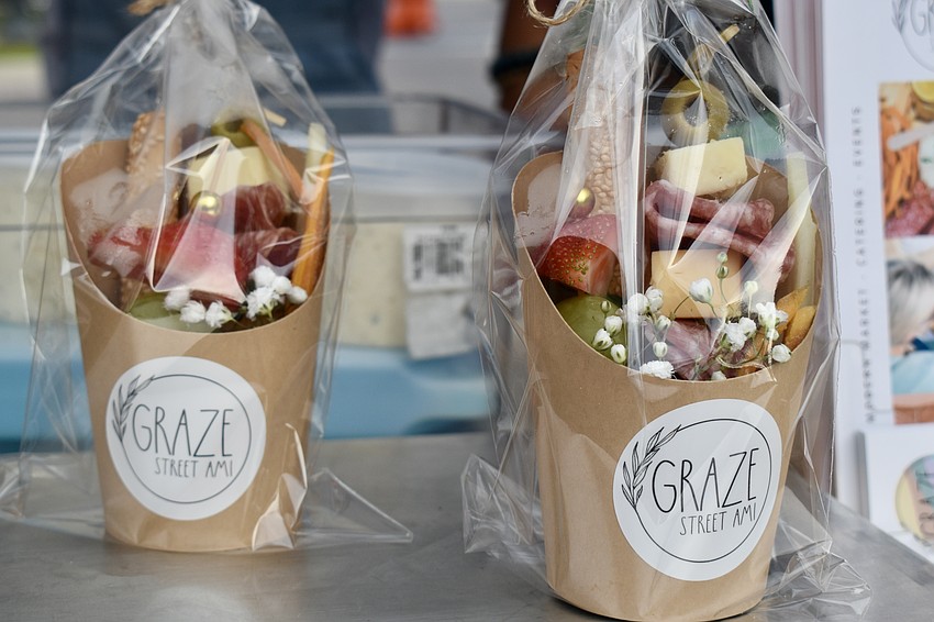 Charcuterie boards in a cup are the perfect appetizer for walking and shopping.