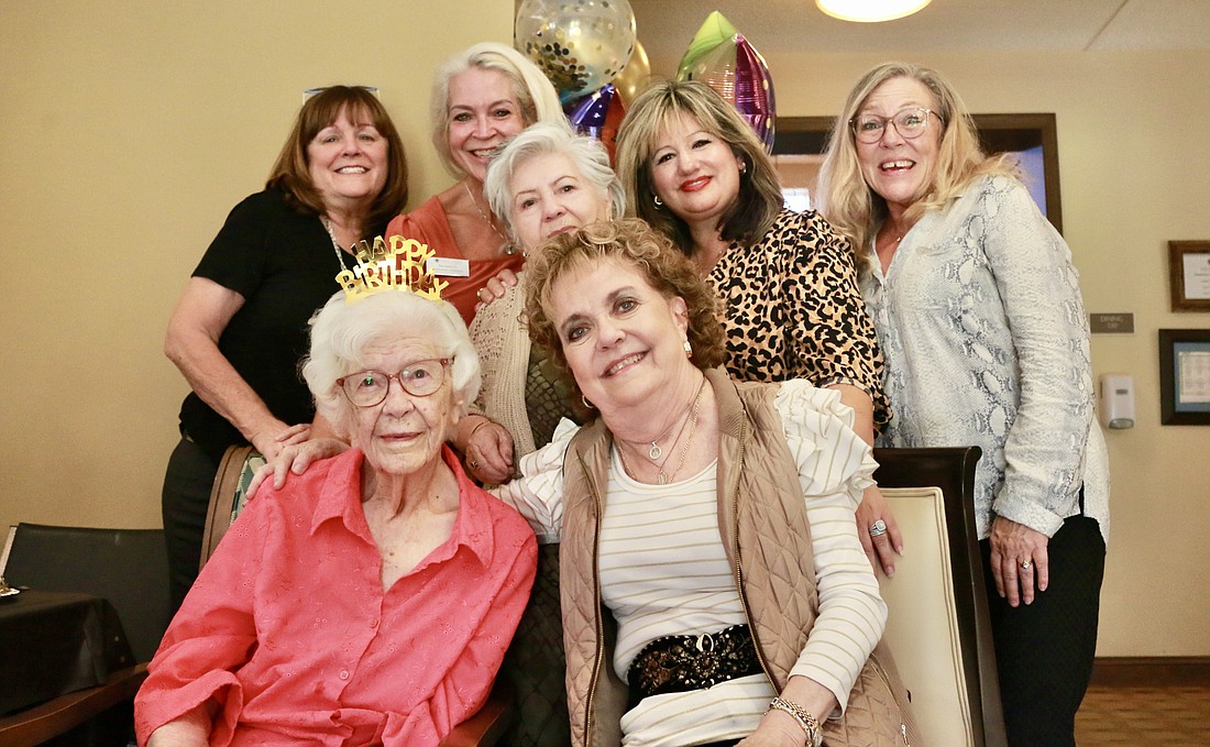 Betty Boles (front left) and her daughter Karen Boles (front right) celebrate Betty Boles' 100th birthday with friends. Photo by Sierra Williams