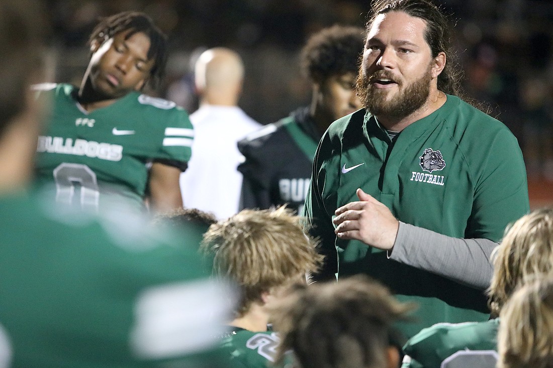 Flagler Palm Coast High School football coach Daniel Fish talks to the team after a game in the 2023 season. File photo by Brent Woronoff