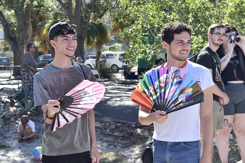 Zach Timmons and Eduardo Marines watch a performance.