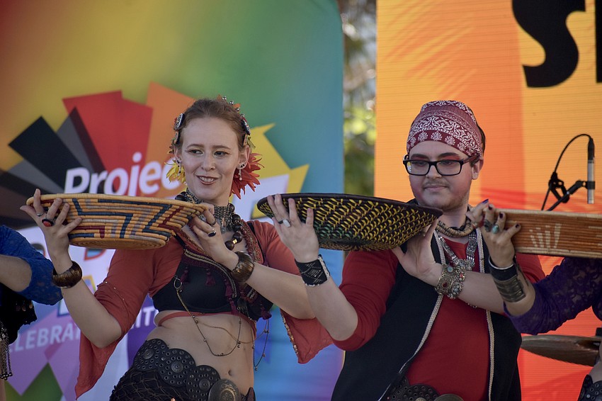 Elizabeth Hall and Seth Grayson of ShimmyBOOM Tribal Bellydance Troupe perform at the event.
