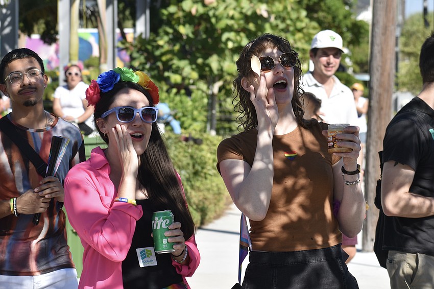 Hollee Stamper and Gretchen Love cheer at a performance.
