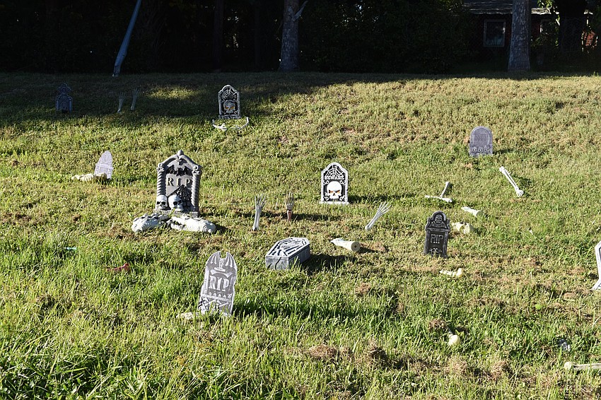 Gravestones adorn the side of the trail.