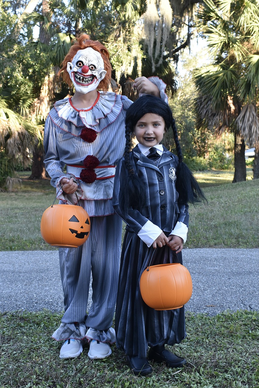 Noah Shaffer, 9, dressed as a clown and Mila Shaffer, 5, dressed as Wednesday Addams.