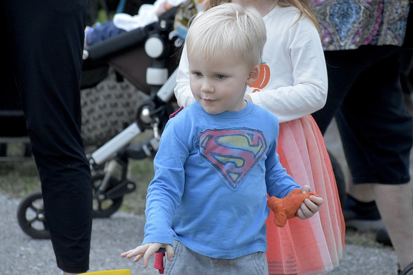 Paxton Boerner, 3, prepares to toss a beanbag.