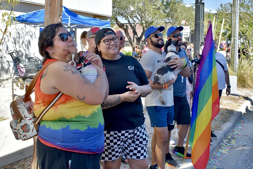 Maria and Karla Gazziro and Alex and Christian Sarruff watch the pet costume contest.