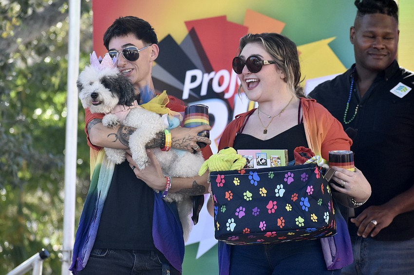 Alicia and Shellsea Hudis-Coe and their dog Minnie take to the stage during the pet costume contest.