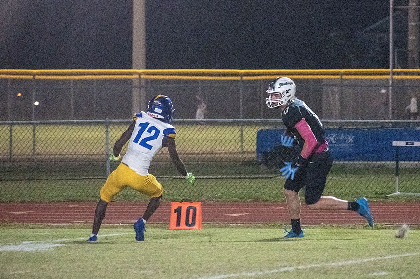 Lakewood Ranch senior receiver Connor Anthony tries to avoid Gibbs defender Jacob Daniels (12) on a catch in the red zone.