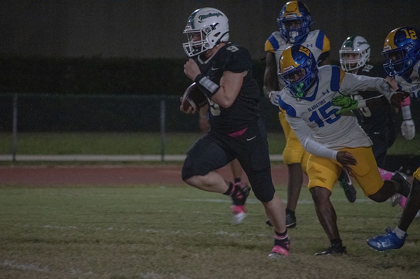 Senior running back Simon Freed breaks free from the Gibbs defense.
