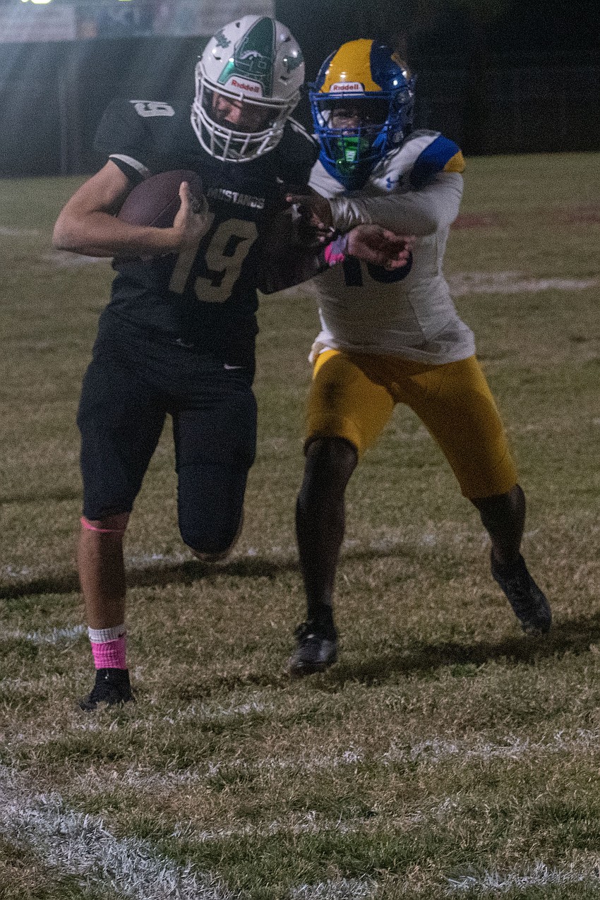 Lakewood Ranch senior kicker/punter Aaron Clark is forced out of bounds on a fake punt attempt.