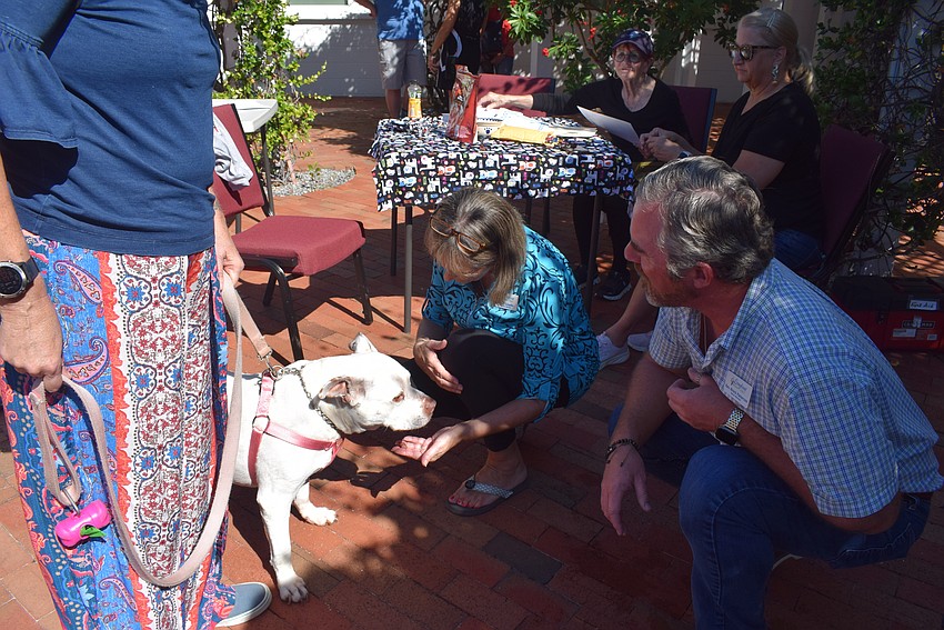 Reverend Brock Patterson blessing Christy and Bob Mazurek's dog, Sybil
