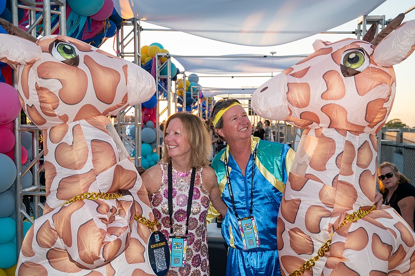 Pam and Doug May with the Giraffes