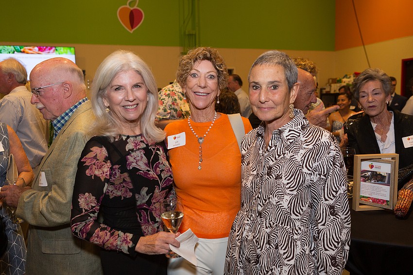 Nelle S. Miller, right, incoming president and CEO of All Faiths Food Bank succeeding longtime CEO Sandra Frank, left, who announced her retirement plans in March. Center is Lin Williams.