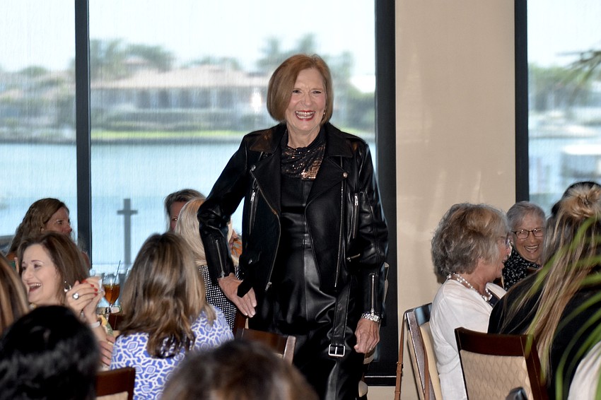 Model Gerri Shea showcases a matching outfit and purse.
