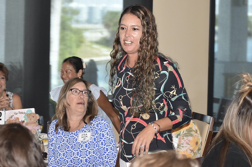 Hyla Mink admires model Ann Pynckels' outfit.
