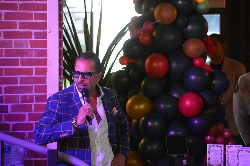 Ronnie Shugar, one of the event's hosts, addresses the crowd.