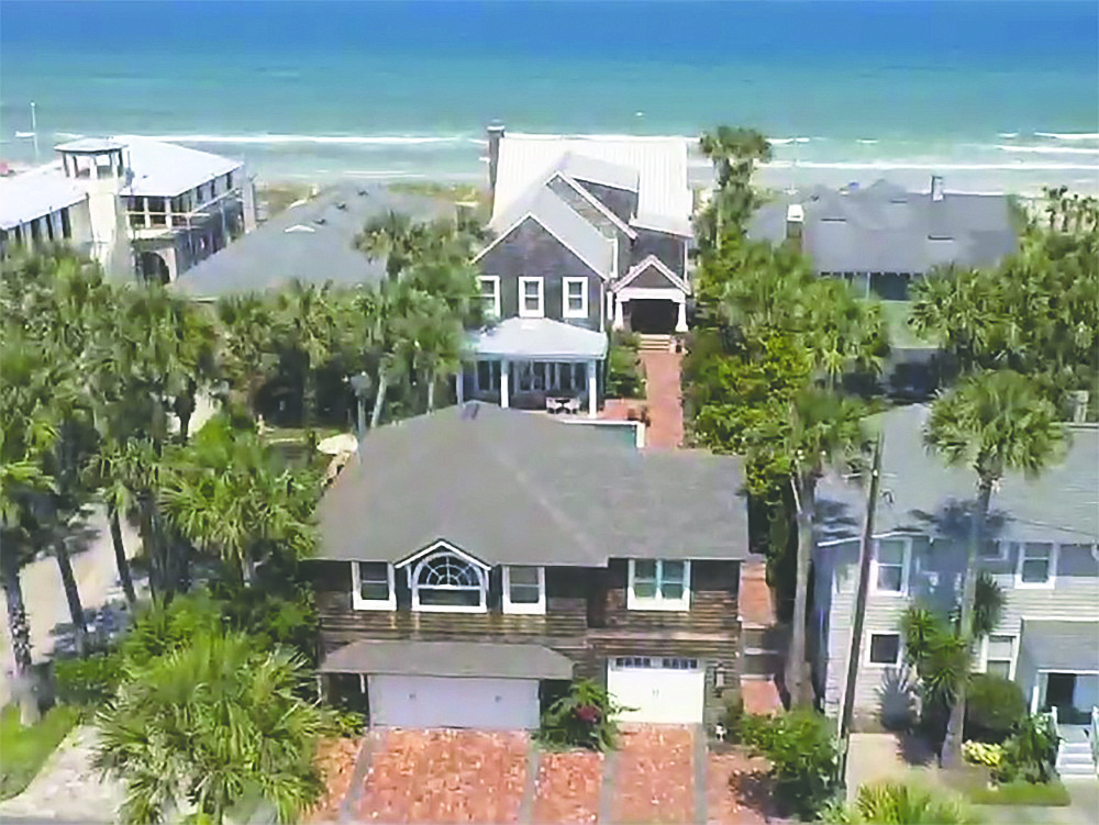 Oceanfront home built in 1923 features seven bedrooms, six full and one half-bathrooms, detached garage with apartment, porch, balcony, decks and pool.