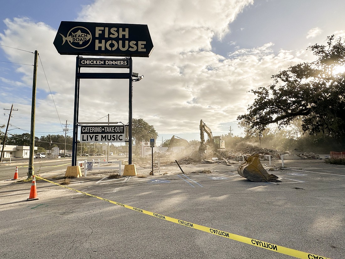 The former Beach Road Chicken Dinners building at 4132 Atlantic Blvd. is demolished Oct. 25.
