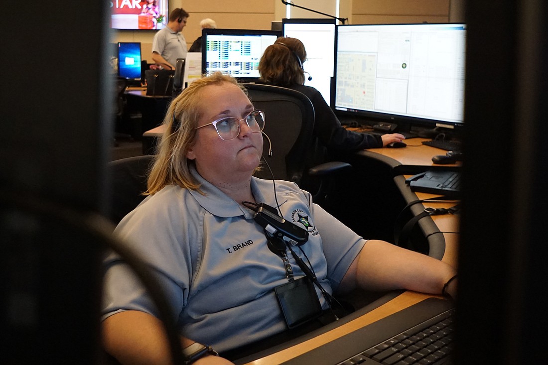 Operator Tia Brand has worked at the Sarasota County Sheriff's Department call center for 14 years.