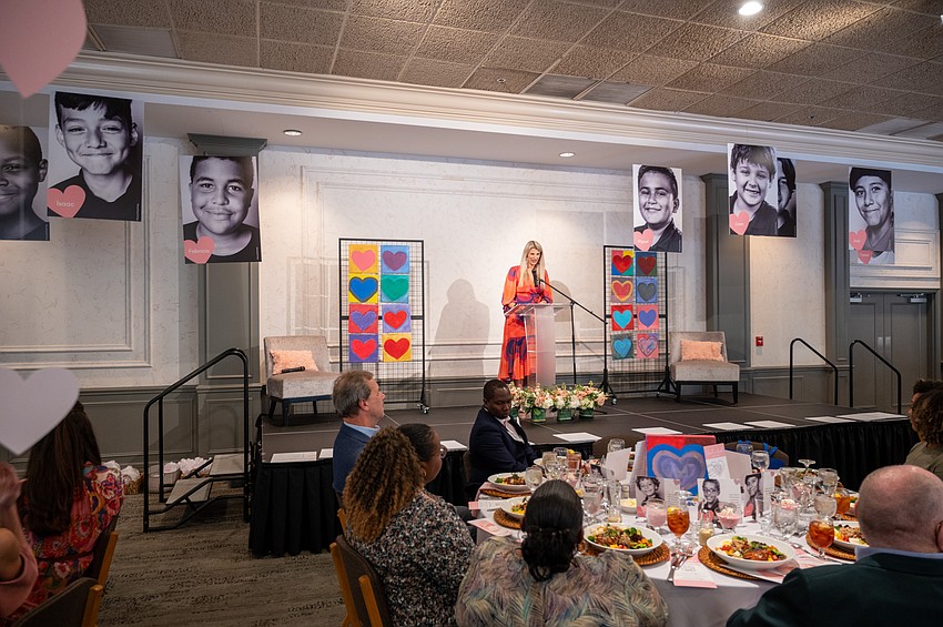Hallie Peilet Young emcees the event.