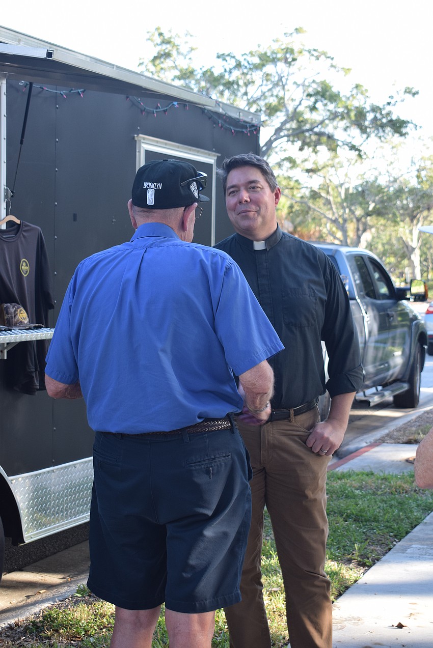 Justus Doenecke and Rev. David Marshall chat at the All Angels Welcome Back party.