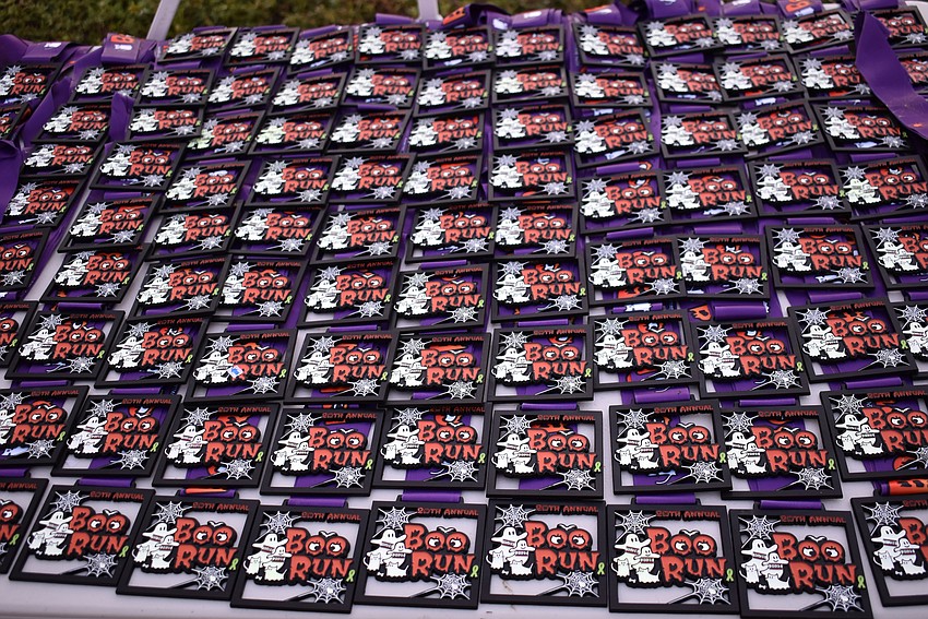 The medals at lined up at the finish line, awaiting the finishers.