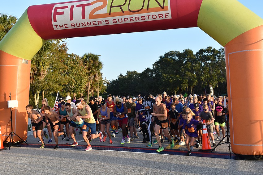 Runners begin the 20th annual Boo Run on Saturday in Lakewood Ranch.