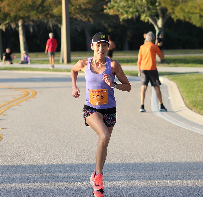 Lakewood Ranch's Fernanda Scalera, who is 54, was the overall women's winner in the Boo Run. She covered the 5K course in 19:58.