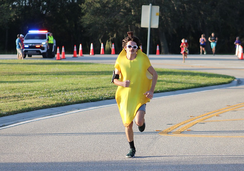 Lakewood Ranch's Nate VanPeenen said he would figure out how to run a 5K in a banana costume during the Boo Run. Considering he is about to cross the finish line, he did.