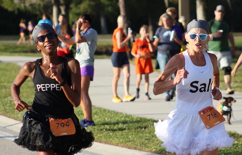 Lakewood Ranch's Regina Morris and Joan Novak went together like pepper and salt and crossed the finish line of the Boo Run at the same time.