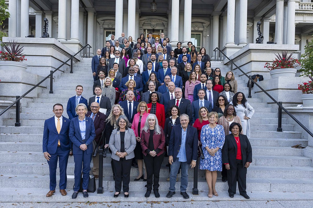 Florida elected officials pose on the Navy Steps of the Eisenhower Executive Office Building at the White House on Oct. 19.