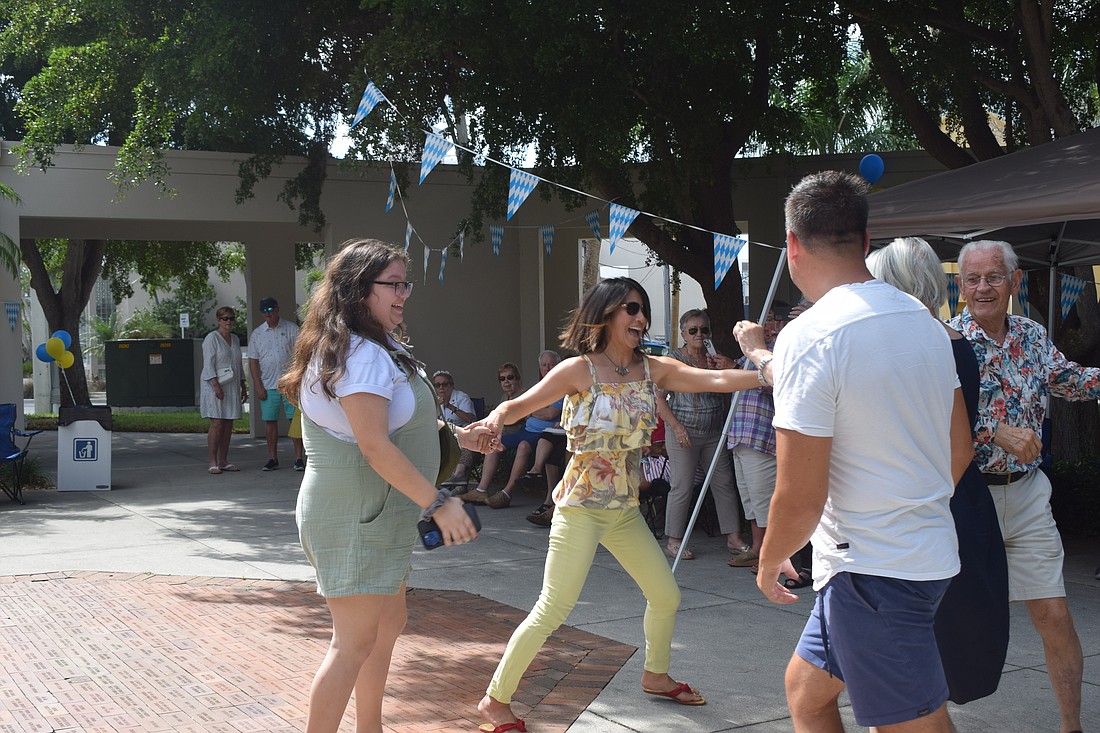 People dancing at Oktoberfest at St. Armands Key Lutheran Church
